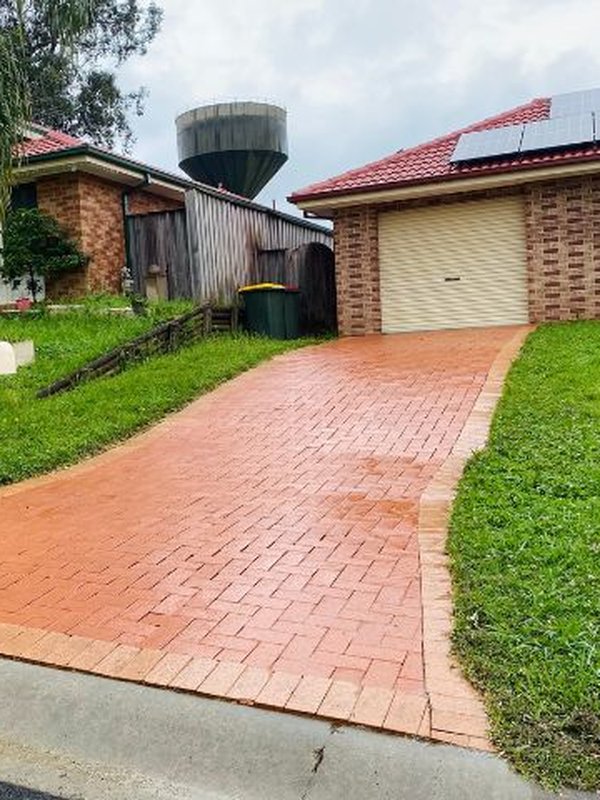 Same Sydney driveway after pressure washing, clean and restored